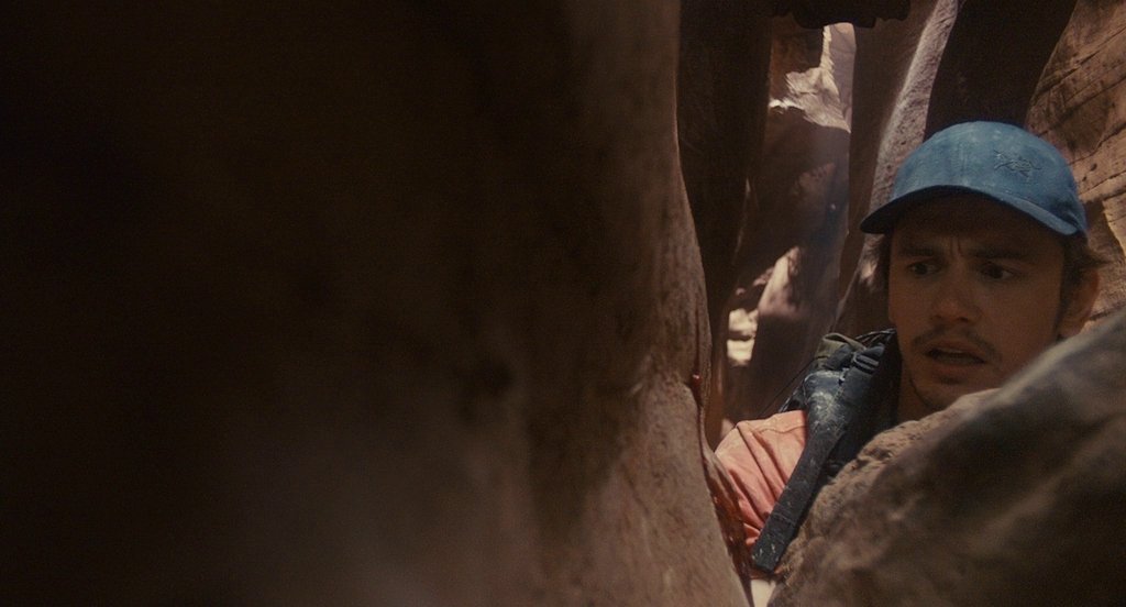 Film still from 127 Hours (2010) showing James Franco's character trapped in a canyon by British director Danny Boyle