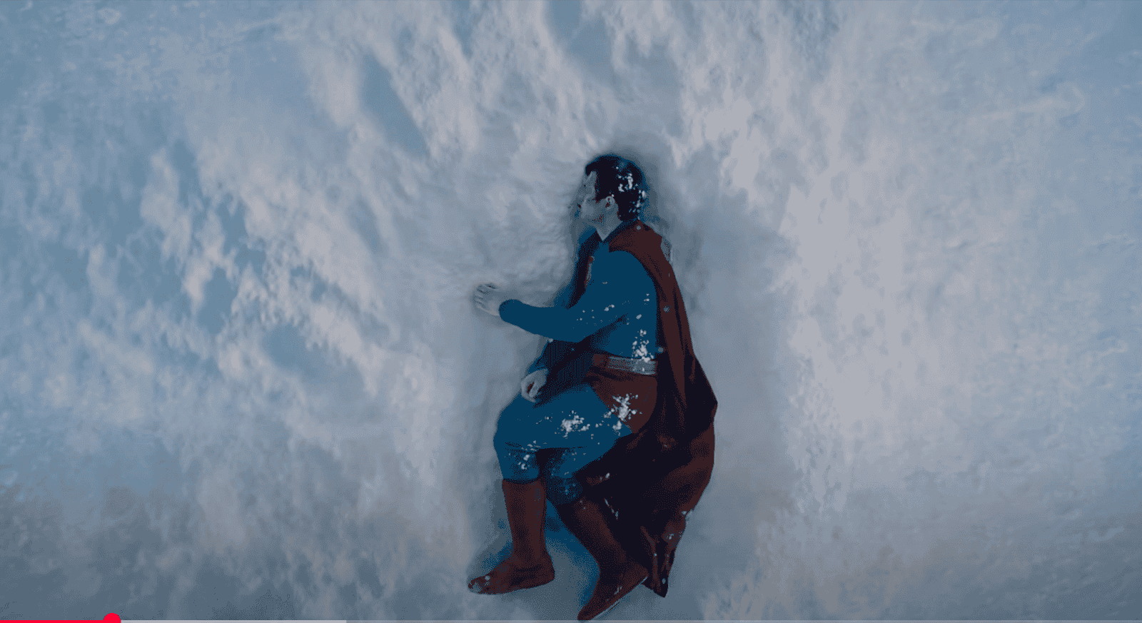 film still from Superman, showing Superman lying in the snow
