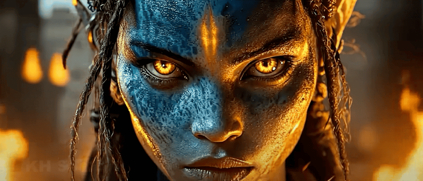 film still showing a character from Avatar staring at the camera with golden eyes