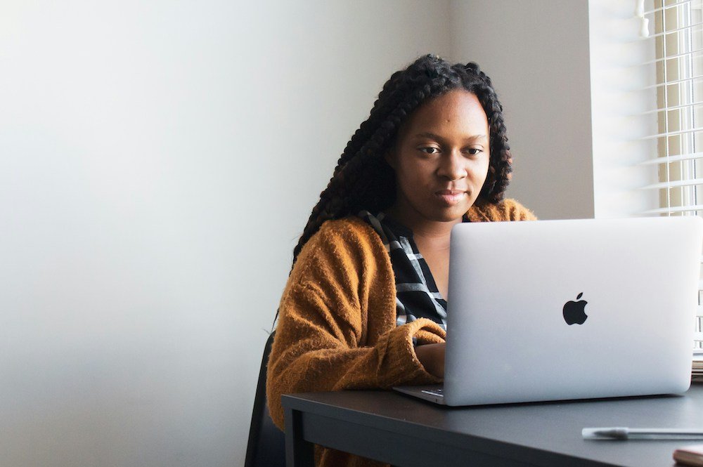 image of a woman working on a laptop