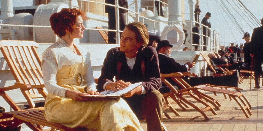 Titanic (1997) – full-scale ship deck set with period-costumed extras during principal photography at Rosarito Studios