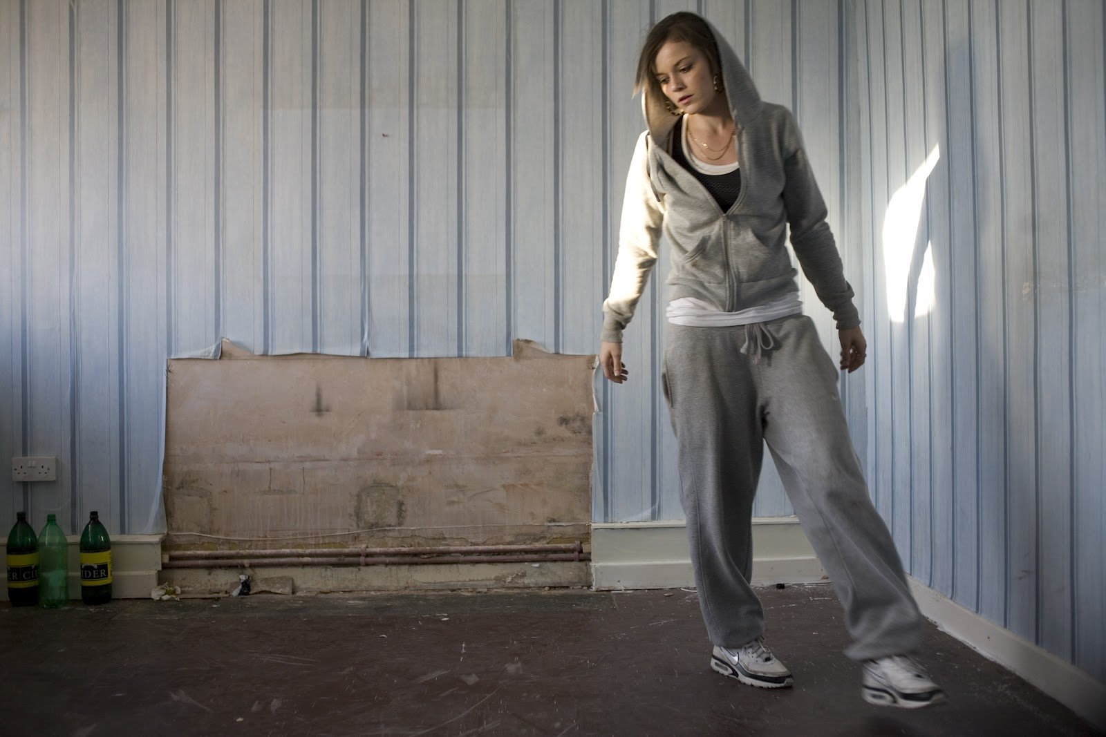 Film still from Fish Tank (2009) showing teenage girl dancing in a room by British director Andrea Arnold