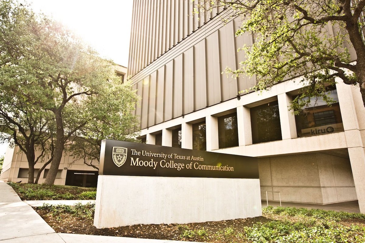 The Moody College of Communication sign outside the main campus building in Austin, Texas